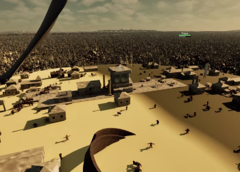 September: a desert settlement from above, sand-coloured buildings and walls in the sun.