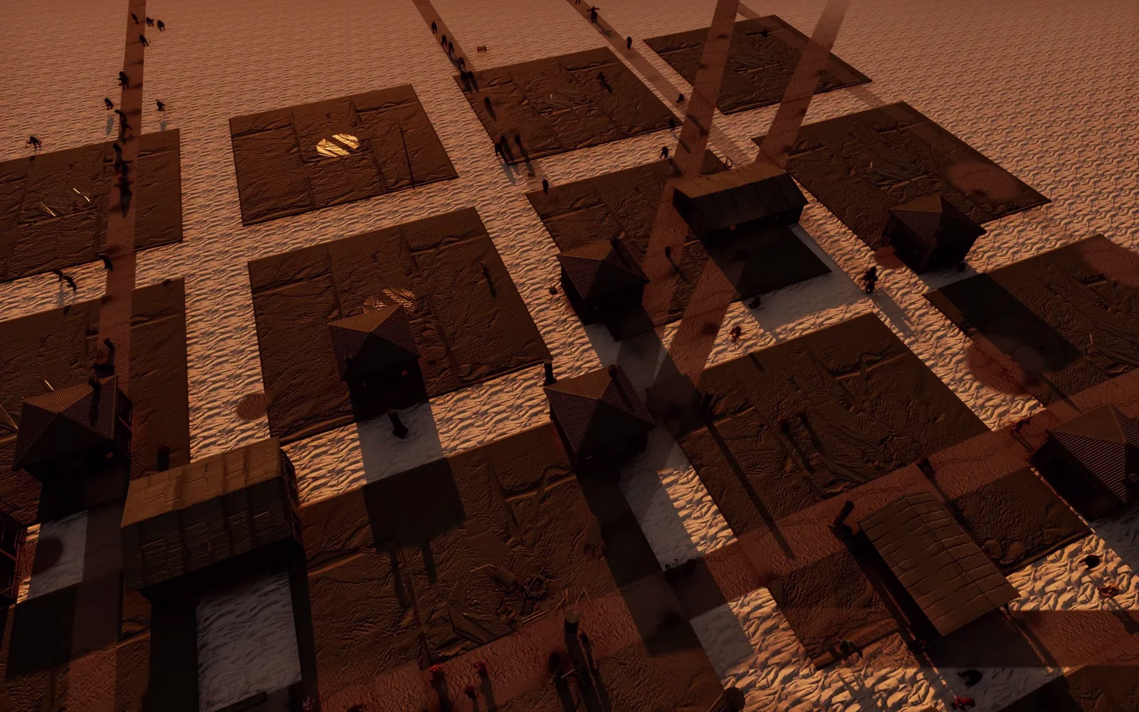 Dark walking figures streaming along paths between rectangular lots and small peaked-roof huts on pale sand under low orange light.