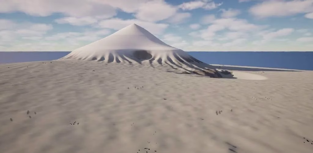 A smooth white snow field with a cone-shaped snowy peak rising from it, a deep blue sea behind, and a few dark specks on the snow under a blue sky with scattered clouds.
