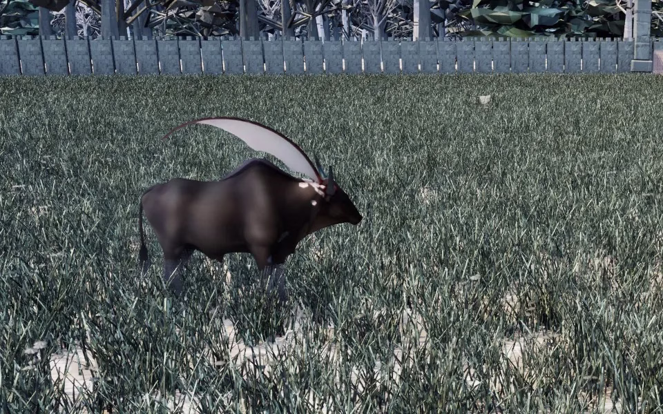 A dark, heavy bull-like beast with a huge pale scythe-shaped crest curving up from its head, standing in frosty grass in front of a stone wall.