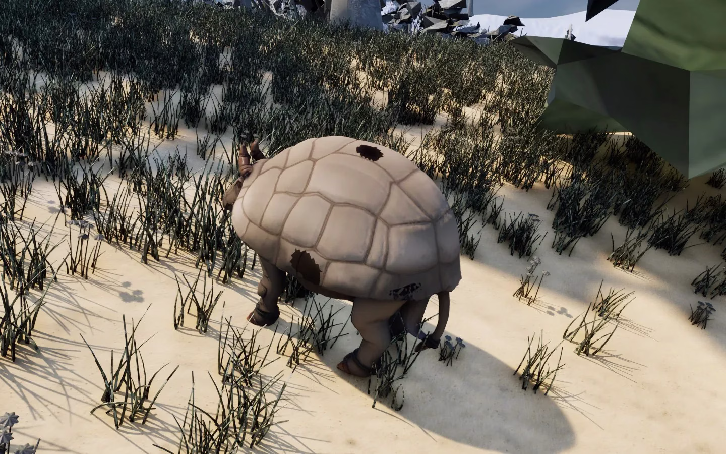 A pale tortoise-shelled beast with two short horns, dark banded legs and a thin tail, walking across a sunlit snowy slope of dark grass with a big mossy rock behind.