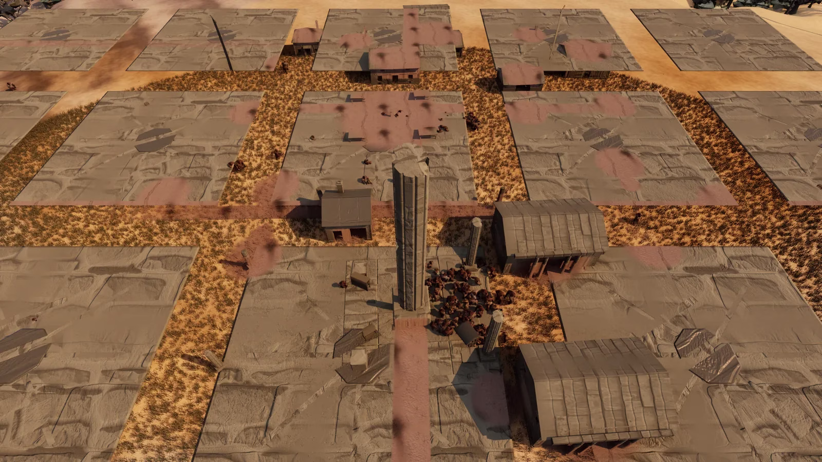An aerial view of a town with a tall stone pillar in the middle, a crowd of brown figures at its base, wooden barns, and large flat grey slabs separated by orange grass paths.