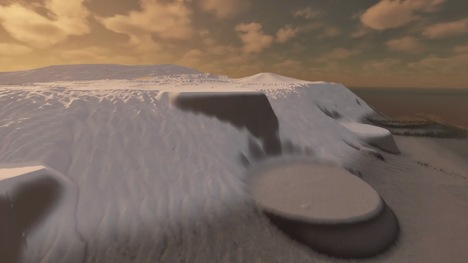A pale white rock plateau with a round flat pan at its foot, under a golden cloudy sky with a dark sea far behind.