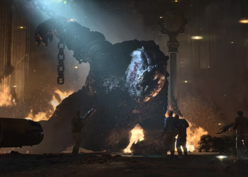 Four soldiers face a giant chained Brumak in a burning city street at night, a chain hanging from its raised fist.