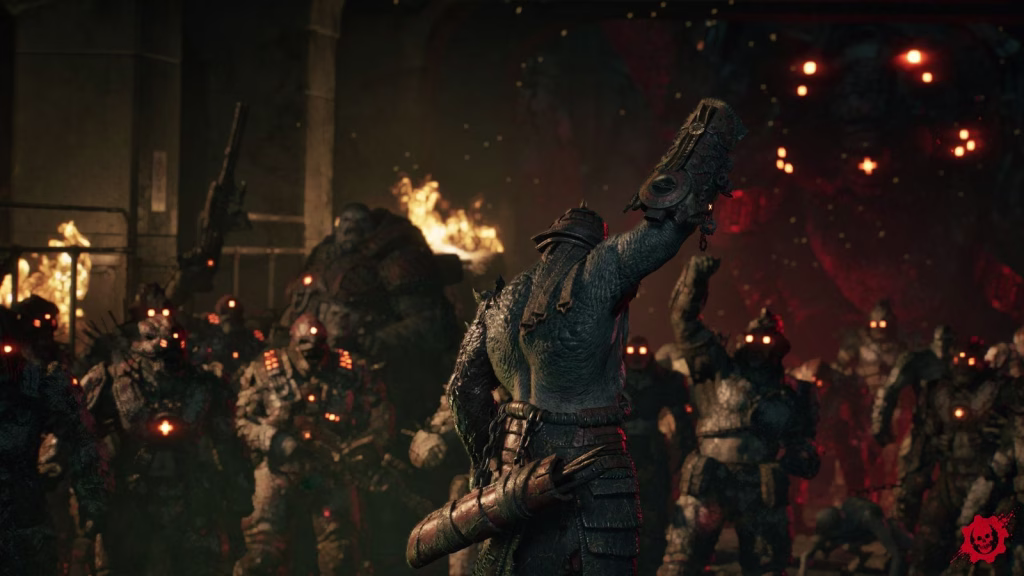 The Locust leader Vraahk, seen from behind, raises a jagged weapon before a horde of Locust soldiers with glowing orange eyes, fires burning behind them.